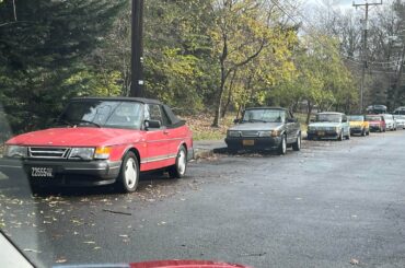 Not weird, just 9 Saab 900s parked all together.