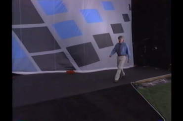 Jay Leno driving a mouse car at the windows 95 launch event