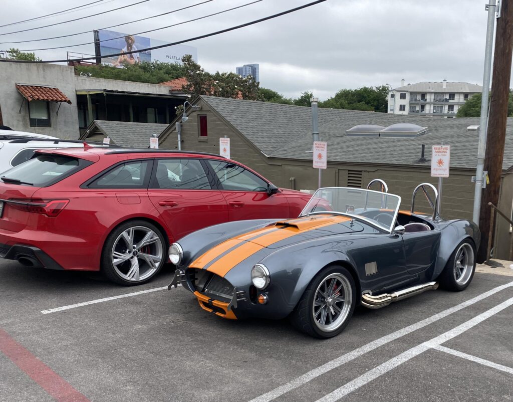 Uniquely colored [Shelby Cobra] replica? looking tiny next to an Audi