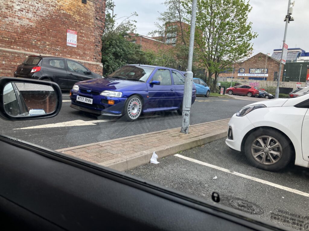 Caught me by surprise, a [Ford Escort RS Cosworth] leaving KFC in Liverpool, England.