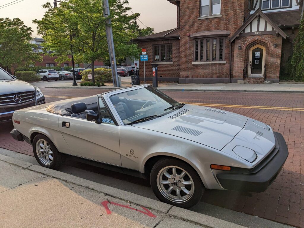 Headlights go up, headlights go down. Who would be driving a clean Triumph TR8??