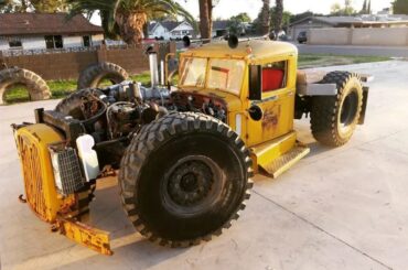 This is 5 Ton Fred - A 1949 Autocar Semi-truck cab on a school bus chassis with 53in Michelin military tyres, powered by a 7.8L turbo diesel with an Allison transmission.