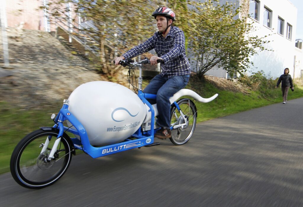 Alan Dowden of the Seattle Sperm Bank rides the Sperm Bike, a custom-designed, high-tech bicycle used to deliver donated sperm to fertility clinics, in Seattle November 8, 2011. The bike has a liquid-nitrogen dewar to keep the sperm. . . fresh in transit.