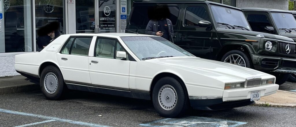 [Mercedes G-Class] visible behind an old Lincoln