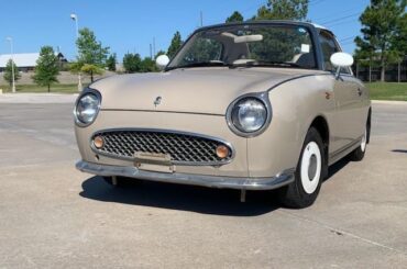 My best friend drives this Nissan Figaro. As far as we know its 1/3 in our state. It's a kei car that was only sold in Japan in 1991.