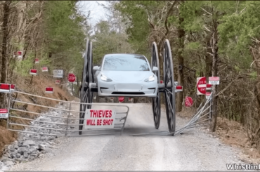 Man puts 10ft buggy wheels on a Tesla and drives it upside down