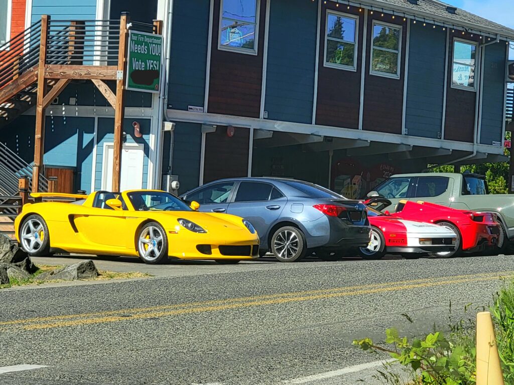 Spot of a lifetime in my tiny town. [Porsche Carrera GT, Ferrari Testarossa, Ferrari 458 Spyder]