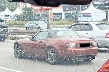Just [Mazda MX-5 Miata NC] rolling down the highway