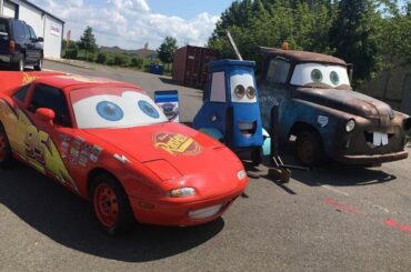 Sitting in front of a local repair shop