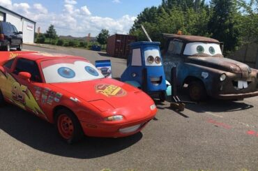 Sitting in front of a local repair shop