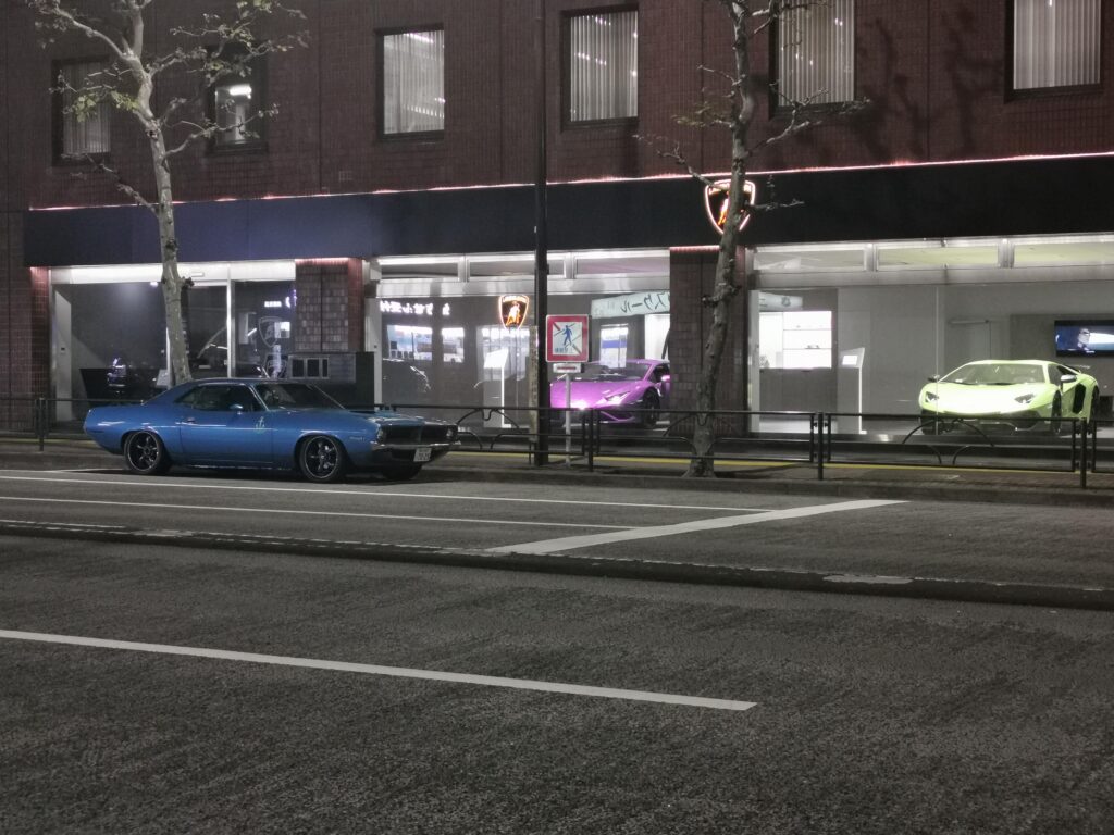 So folks, what would you rather have? The blue [Plymouth 'cuda] or the [multi] italians in the showroom?