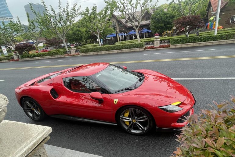 [Ferrari ?] looks like a newer model. Sounded fast and expensive.