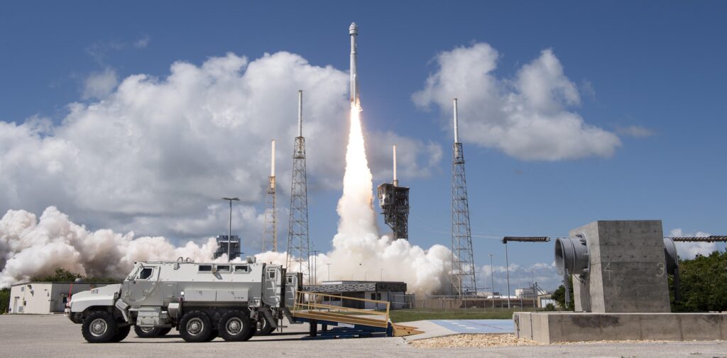 Two emergency egress vehicles are seen positioned at the slidewire termination area at Space Launch Complex 41 as a United Launch Alliance Atlas V rocket with Boeing’s CST-100 Starliner spacecraft aboard launches from Cape Canaveral, Florida on Wednesday, June 5, 2024.