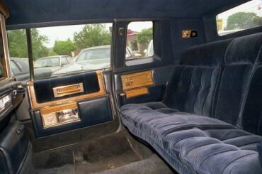 Why did luxury car brands stop including dividers between the front and back seats?