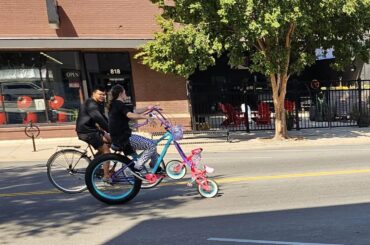 A bike where the front wheel is a smaller bike