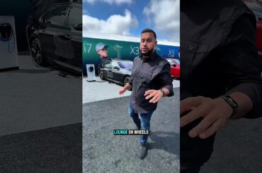 This BMW has a THEATER in the back seat