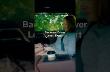 Stash your phone, set your temp, and pull up the sunshade. Unlock next-level comfort from the back.