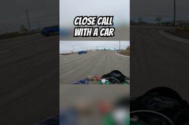 Electric car almost crashes racing a motorcycle!