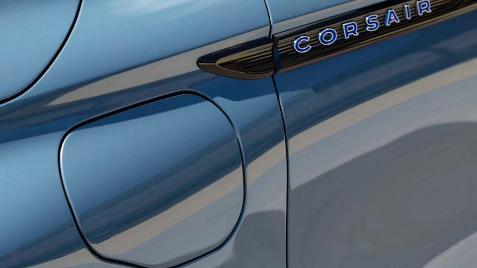 Close-up shot of the charging port door on the wing of a gray 2023 Lincoln Corsair.