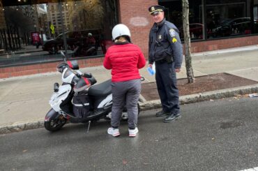 A-1 Officers Conduct Safety Event for Food Delivery Drivers on Mopeds, Bicycles, and E-Bikes – Boston Police Department