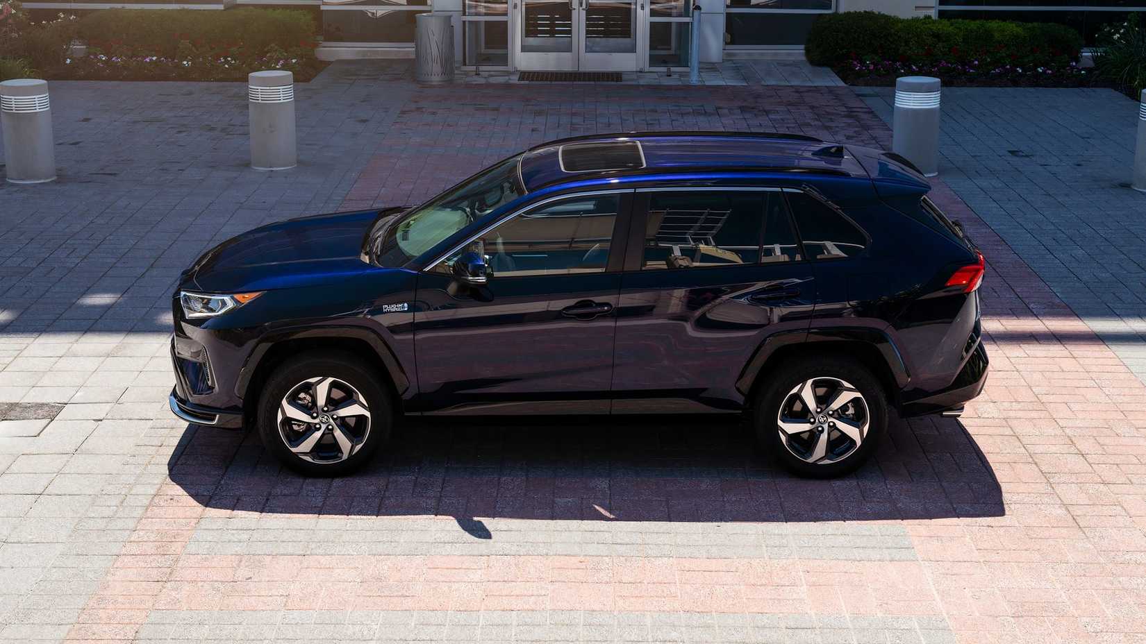 Side profile shot of a blue 2023 Toyota RAV4 Prime SE