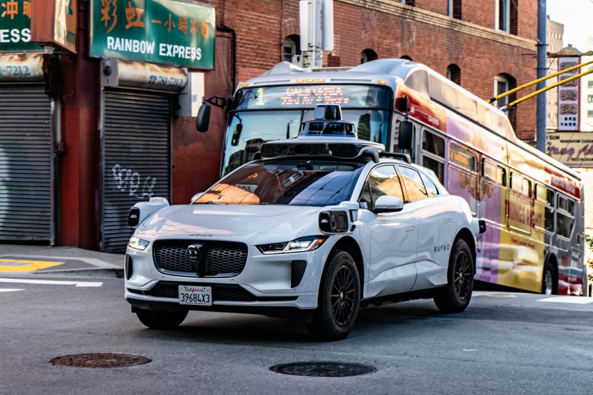 A Waymo car travels down a street in San Francisco. According to a study from the Journal of Transport Geography, focusing on electric and autonomous vehicles alone will not meaningfully reduce traffic-related harm or environmental damage, which would ultimately require reducing overall car ownership.