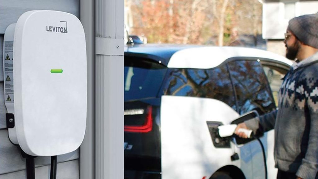 man using Leviton smart 48A level 2 EV charger to power vehicle
