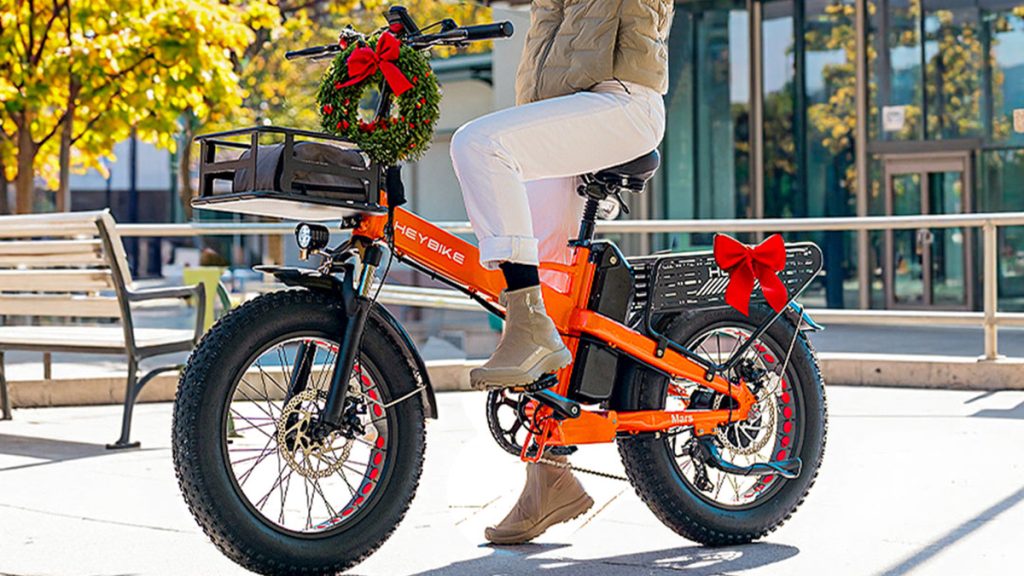 woman riding on Heybike Mars 2.0 e-bike with christmas wreaths