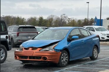 2018 Toyota Prius with an orange 2001 Pontiac Grand Am front bumper, the official car of??