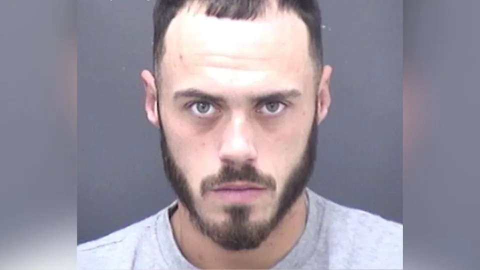 Custody picture of Jonjay Harrison, 25 wearing a grey sweatshirt