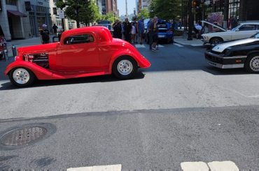 A line up of classic muscle cars and custom
