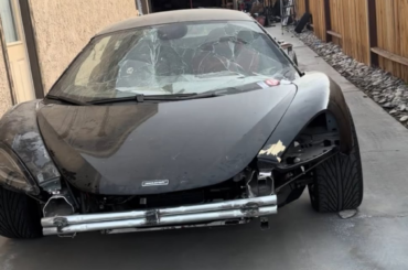 Someone swapped a Honda K24 4-cylinder engine into a wrecked McLaren.