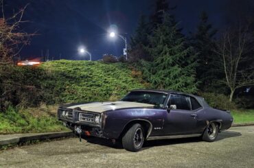 Street parked beater '69 GTO convertible