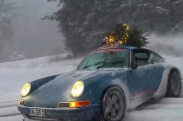 Dashing through the snow in a Singer Porsche 911... with the Christmas tree on top