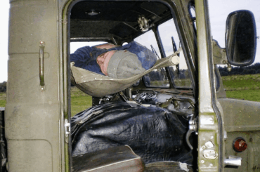 The weirdest sleeping arrangements in trucking history: A Soviet hammock over the engine, a German "coffin" beside the wheel, and a Dutch roof-box.
