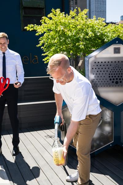 Eric Dahlgren, Co Founder Of Aircela, Fills A Bottle With Gasoline Made On Site