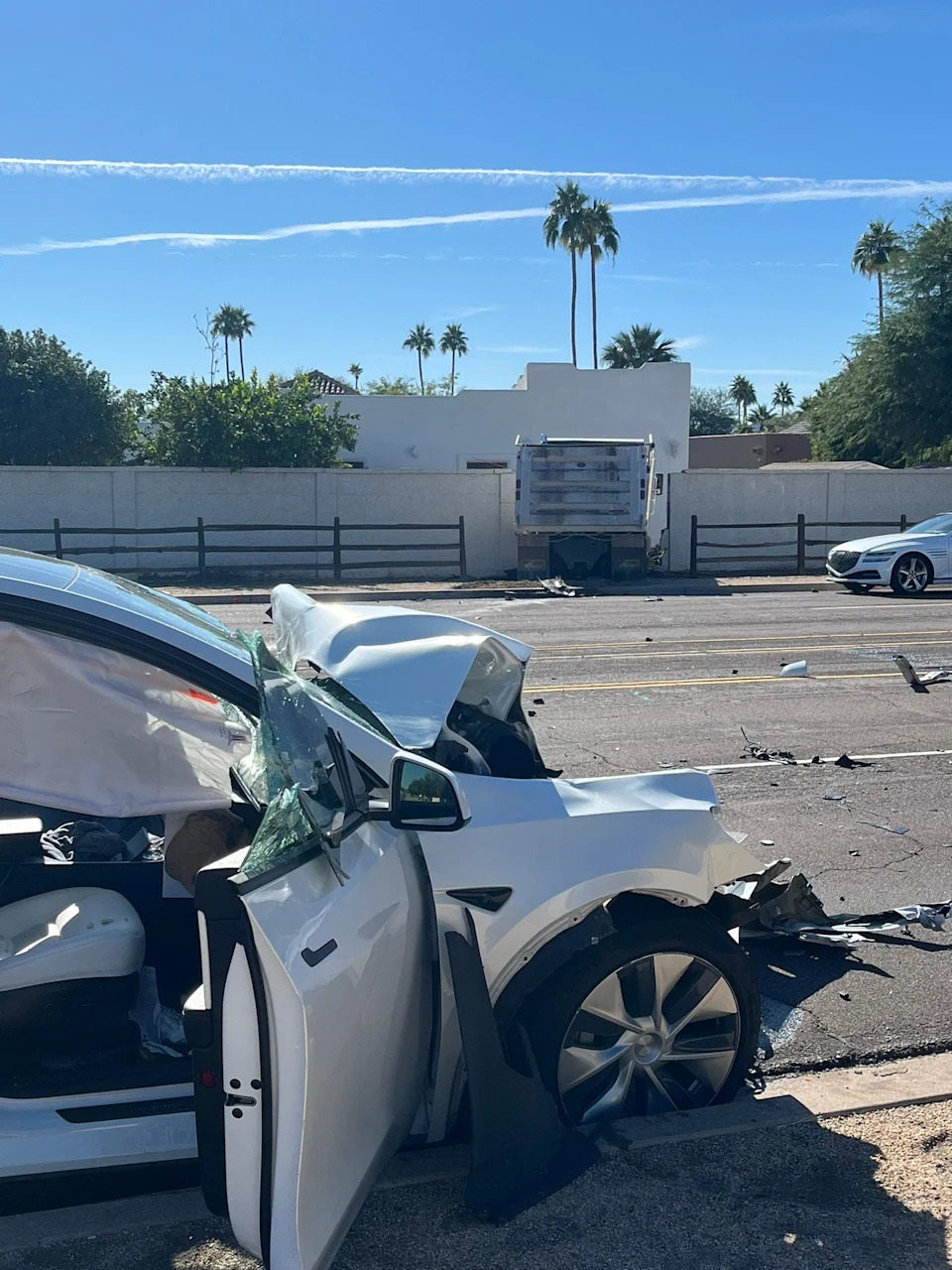 The aftermath of a crash in central Scottsdale that left two people hurt and involved a Tesla and a dump truck on Dec. 2, 2025.