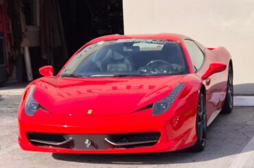 [Ferrari 458 and California T] in front of a local upholstery/trim shop...