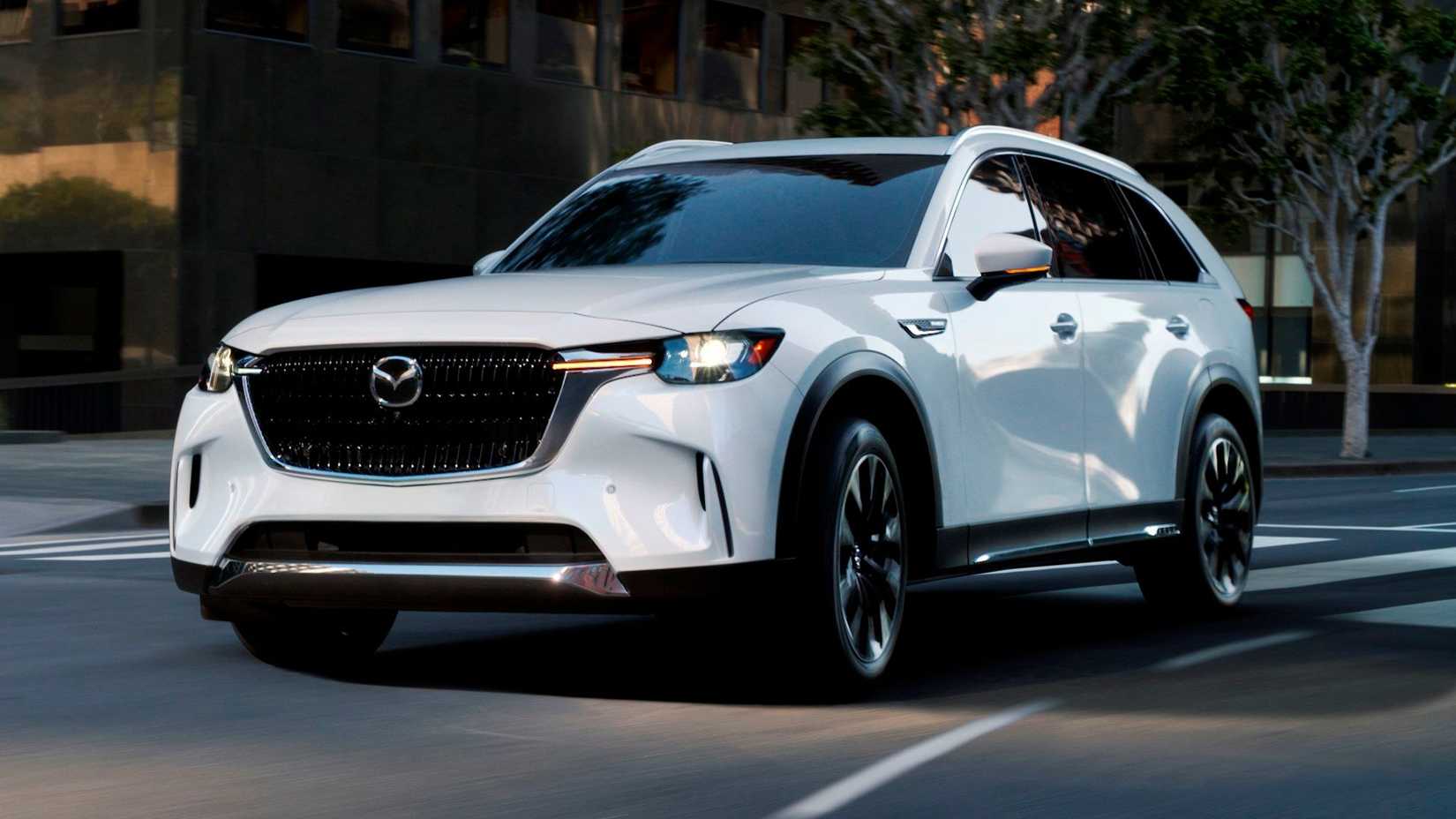 2025 Mazda CX-90 PHEV in white being driven on road