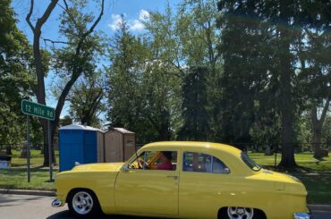 A customized 1949-1951 "Shoebox" Ford, known for its significant post-war redesign that abandoned running boards and integrated fenders.