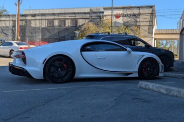[Bugatti Chiron] casually parked next to a Mazda