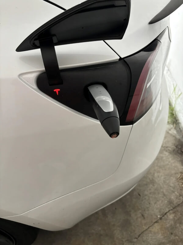 One Tesla owner, expecting a fully charged ride, found a cut charge cable instead, with just the nozzle left sticking out.