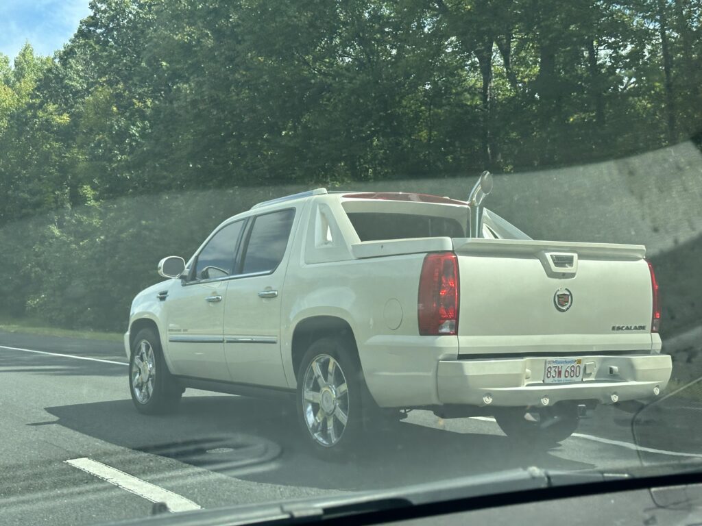 Cadillac Escalade EXT with a chrome stack. Official vehicle of?