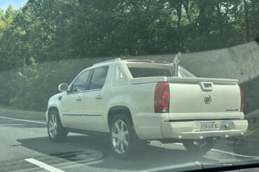 Cadillac Escalade EXT with a chrome stack. Official vehicle of?