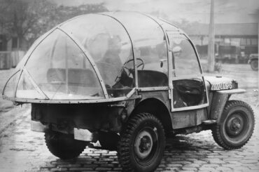 The American winter jeep - soldiers of the 644th Ordnance Depot using one ‘of the cars which has been fitted with a plastic, tear-drop enclosure complete with wipers, spotlight and screen defroster, 1945.