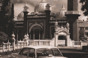 A Ford Zodiac Mark III posed in front of the classy Jamia Mosque in Nairobi, featured in promotional material ahead of the 10th East African Safari Rally. April 1962.