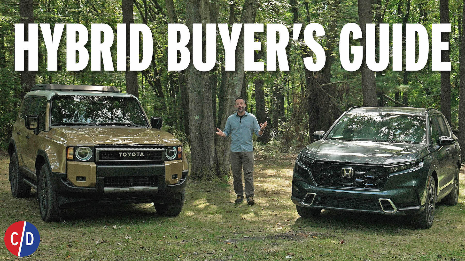 front three quarter view of suv driving on road beside lake.