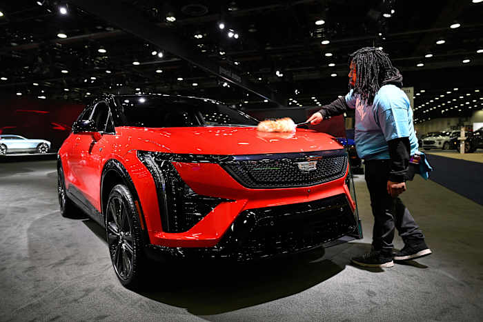 At Detroit auto show, spotlight dims for EVs