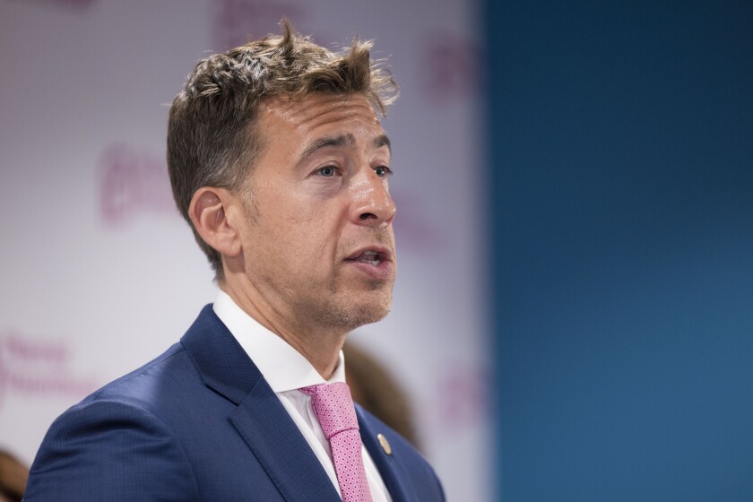 Illinois Secretary of State Alexi Giannoulias speaks at a news conference.