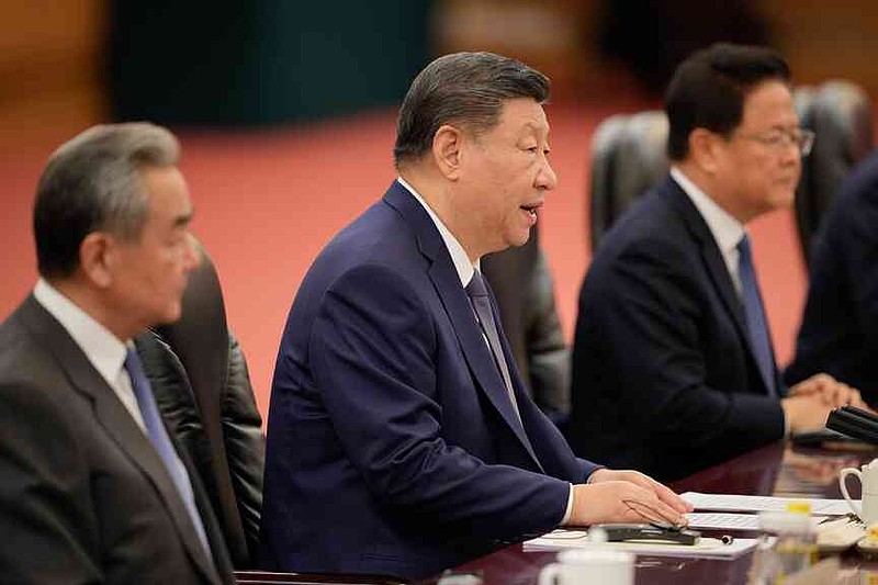 Chinese President Xi Jinping, centre, reacts during a meeting with Canada's Prime Minister Mark Carney (not in the picture), at the Great Hall of the People in Beijing, China, Friday, Jan. 16, 2026. (AP Photo/Vincent Thian, Pool)